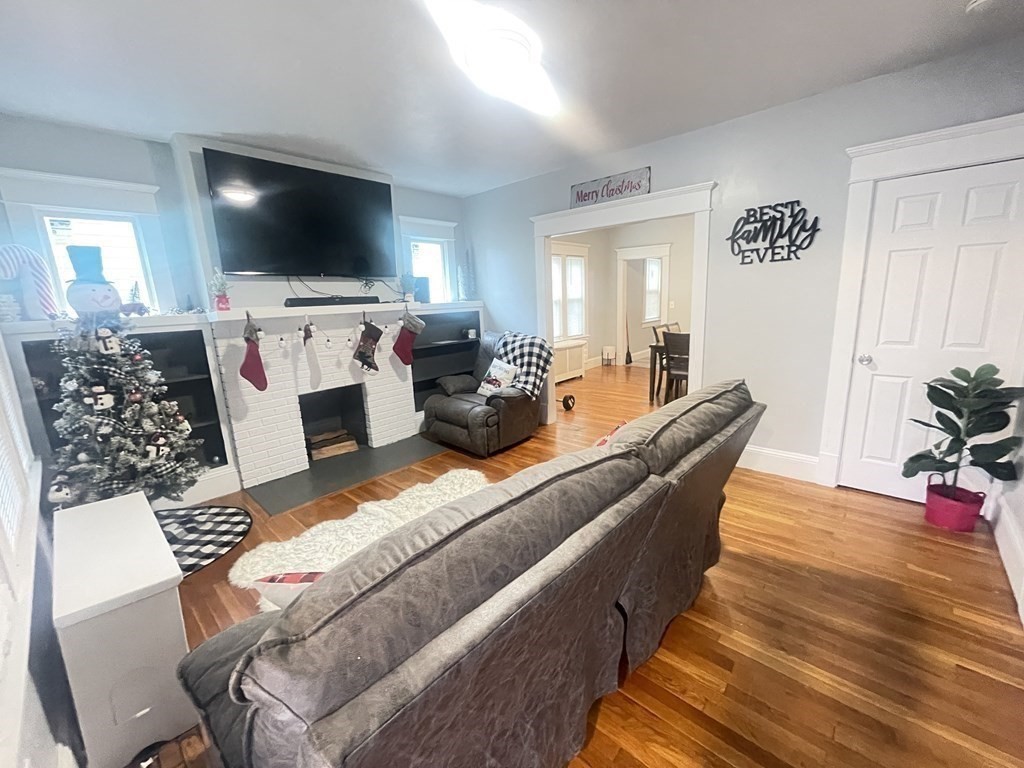 32-34 Rittenhouse Terrace Springfield, MA 01108 - Photo 4 of 23 a living room with furniture and a flat screen tv