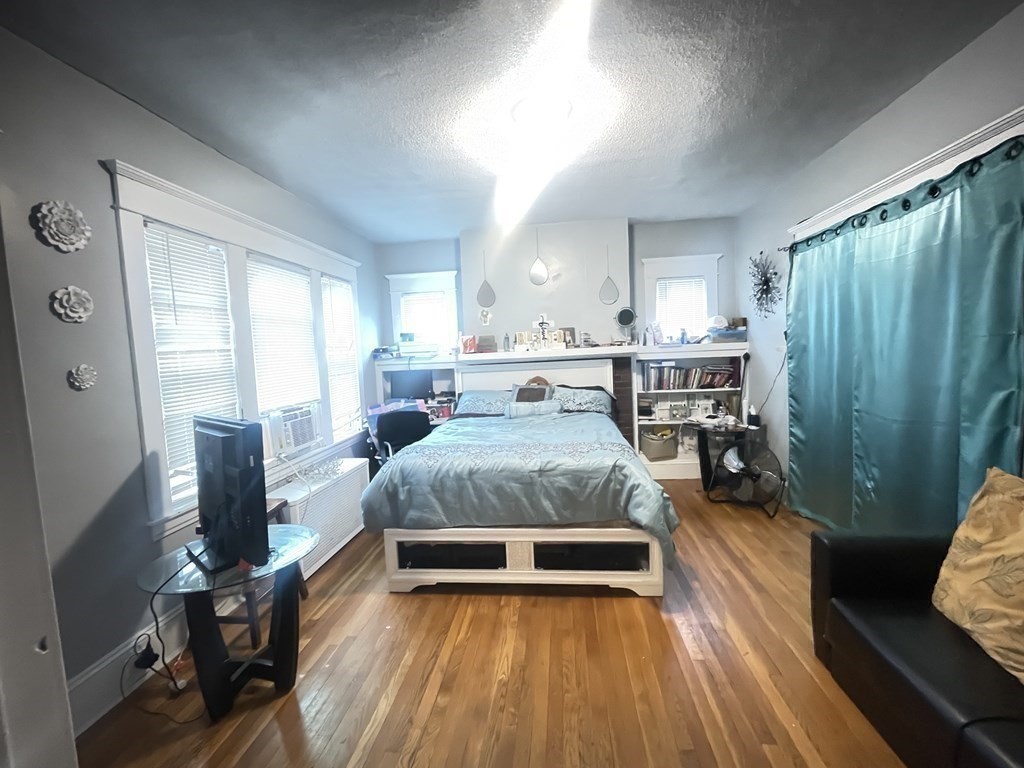 32-34 Rittenhouse Terrace Springfield, MA 01108 - Photo 10 of 23 a spacious bedroom with a bed and large windows