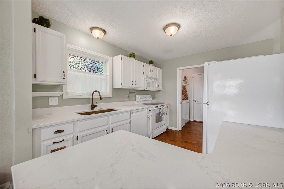 16 Duckhead Road Lake Ozark, MO 65049 - Photo 6 of 50 Bright white Kitchen with Quartz countertops