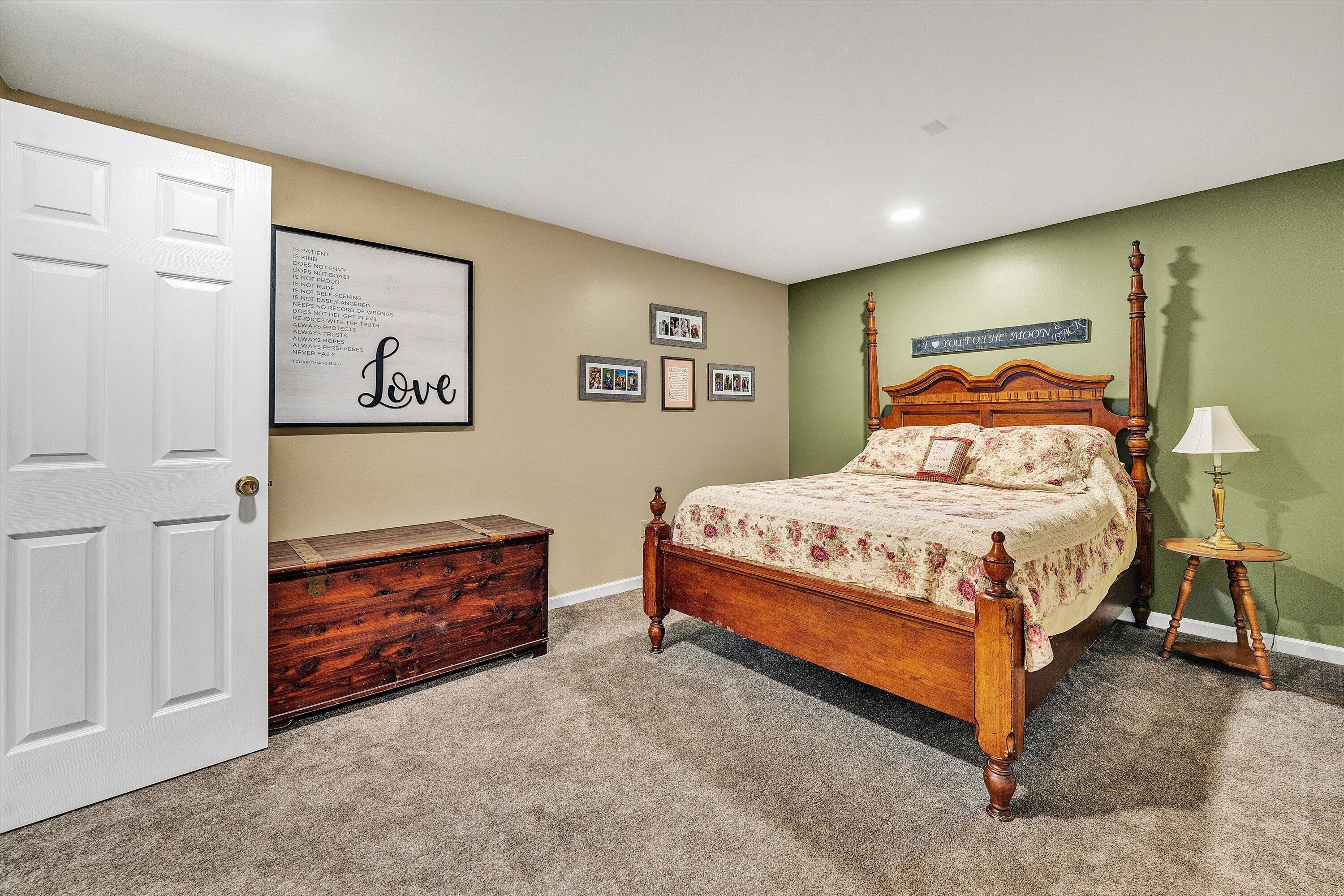 180 Thompson Ridge Circle Ferrum, VA 24088 - Photo 52 of 74 a bedroom with a bed and dresser