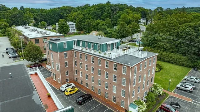 a view of a brick building with a yard