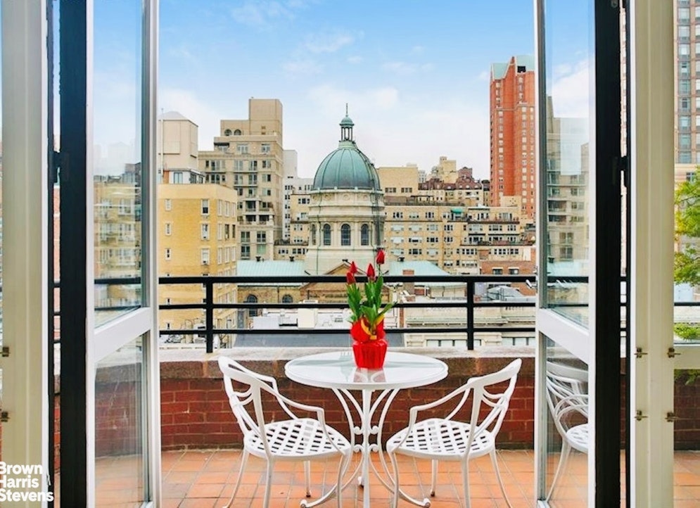 157 East 74th Street, Unit 10B Manhattan, NY 10021 - Photo 11 of 14 a picture of a table and chairs in the balcony