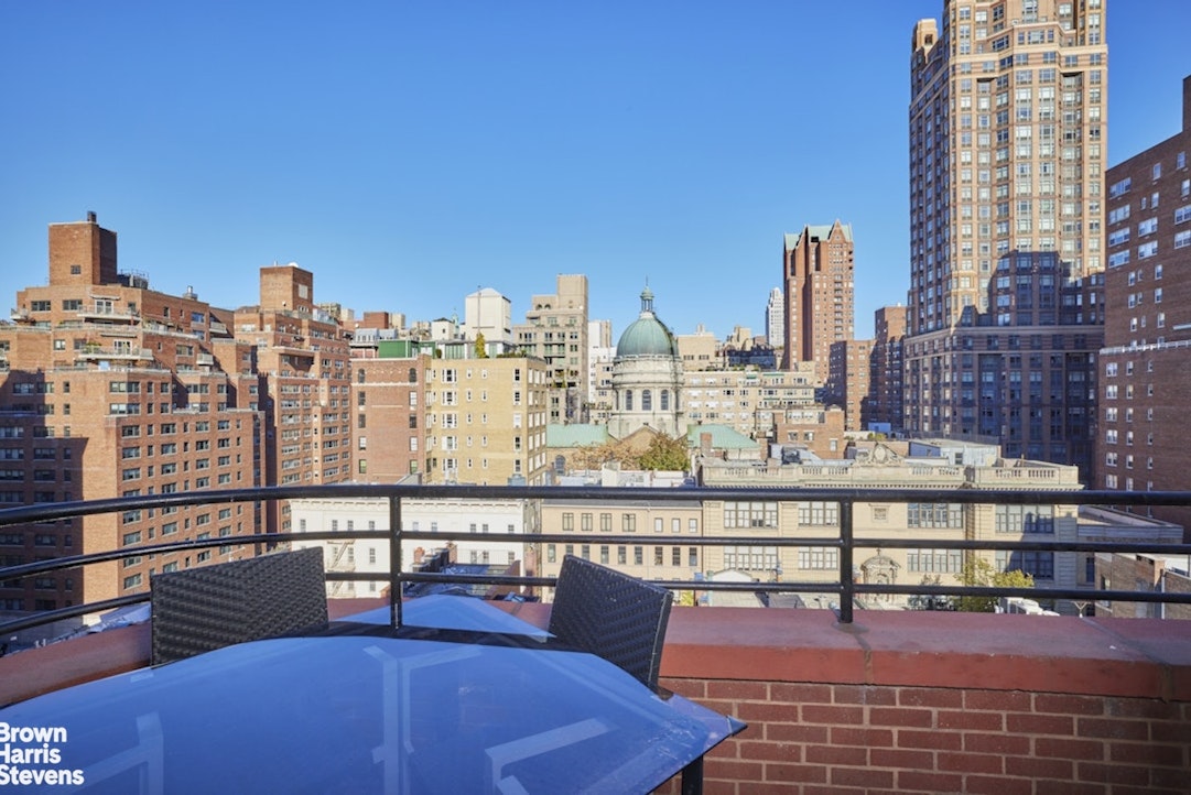 157 East 74th Street, Unit 10B Manhattan, NY 10021 - Photo 3 of 14 a view of a city with tall buildings