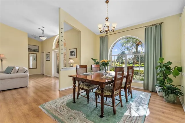 a bed room with a bed and a chandelier