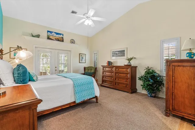 a bathroom with a granite countertop tub a sink and a window