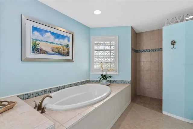 a view of a room with furniture and wooden floor