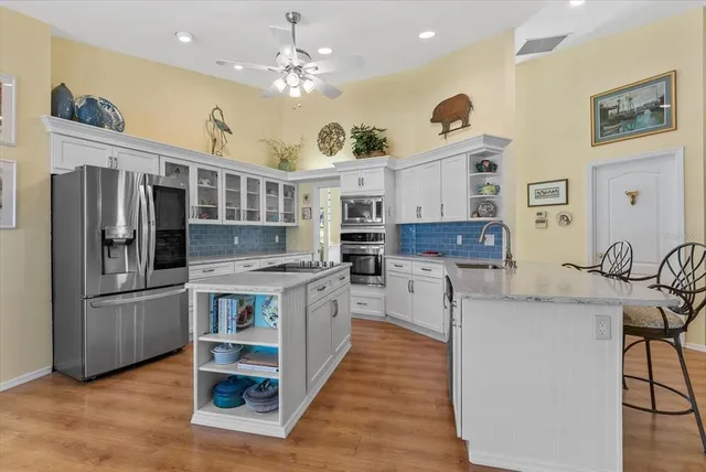 a kitchen with a sink and cabinets