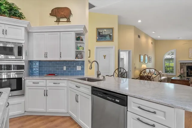 a living room with furniture a window and a fireplace