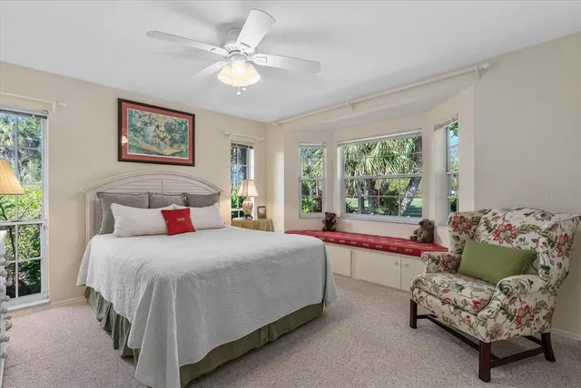 a bedroom with a bed a bed and a chandelier