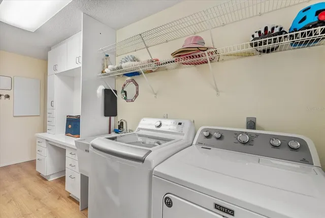 a view of a swimming pool with sitting area