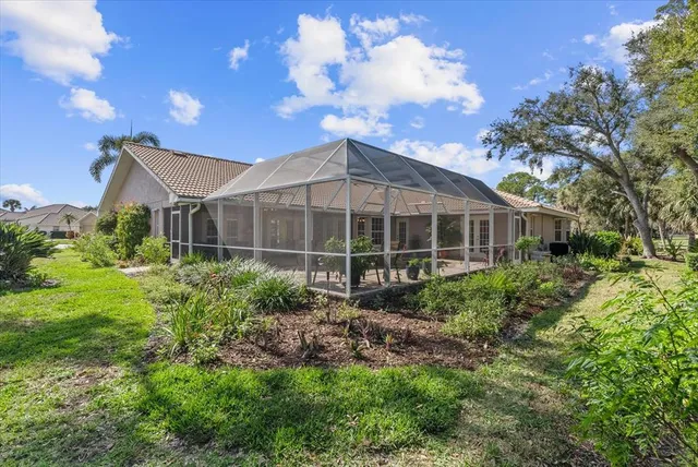 an aerial view of a house with outdoor space