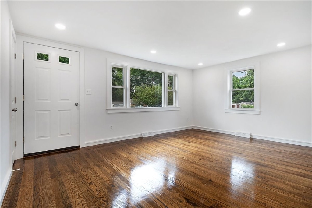 5 Rondeau Road Bellingham, MA 02019 - Photo 11 of 32 an empty room with wooden floor and windows
