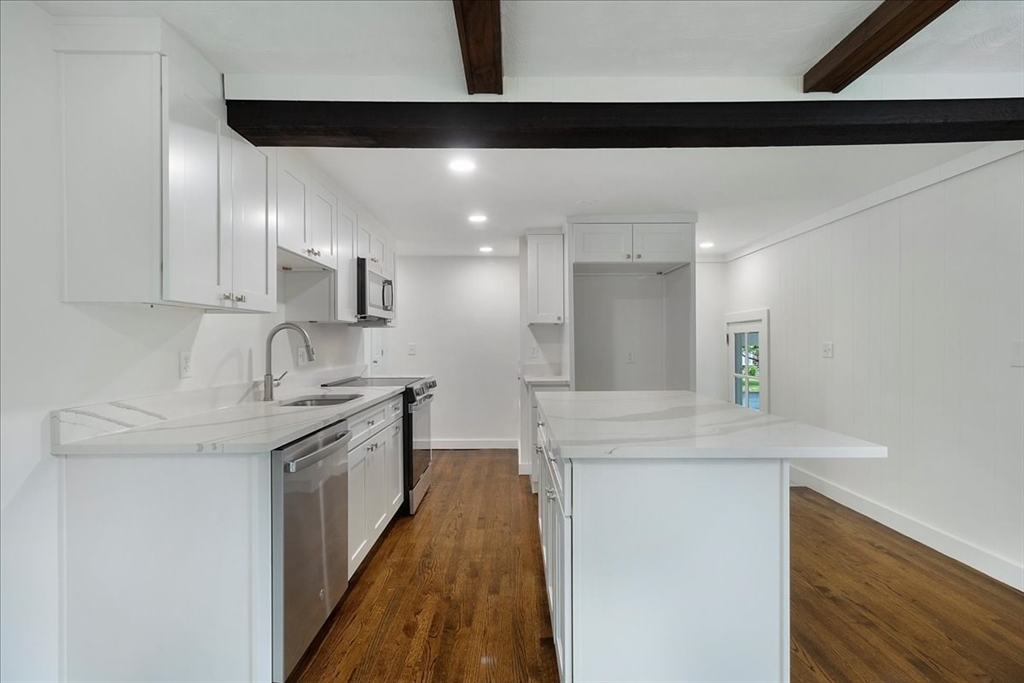 5 Rondeau Road Bellingham, MA 02019 - Photo 13 of 32 a kitchen with stainless steel appliances granite countertop a sink and a stove