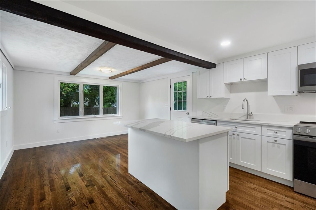 5 Rondeau Road Bellingham, MA 02019 - Photo 15 of 32 a kitchen with a sink stove and cabinets