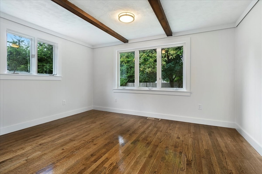 5 Rondeau Road Bellingham, MA 02019 - Photo 17 of 32 an empty room with wooden floor and windows