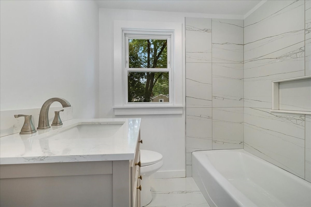 5 Rondeau Road Bellingham, MA 02019 - Photo 18 of 32 a bathroom with a sink and a bathtub
