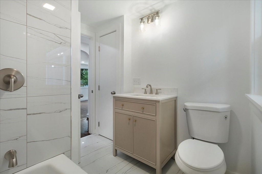 5 Rondeau Road Bellingham, MA 02019 - Photo 19 of 32 a bathroom with a toilet a sink a vanity and shower