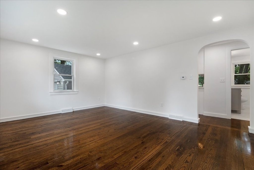 5 Rondeau Road Bellingham, MA 02019 - Photo 9 of 32 an empty room with wooden floor and windows