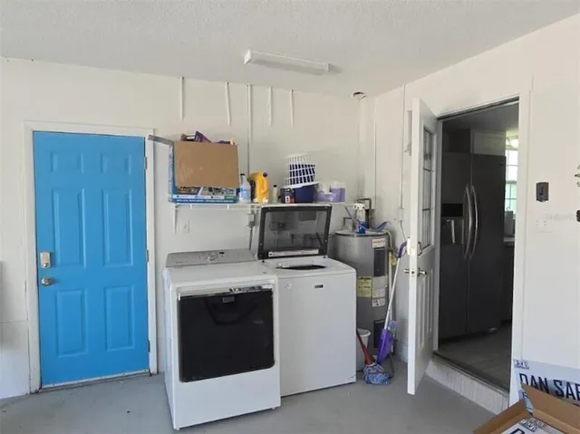 a kitchen with a stove and a refrigerator