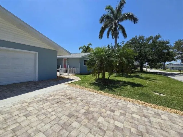 a house with palm tree in front of it