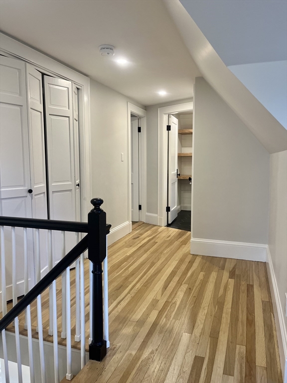 11 Park Lane Walpole, MA 02032 - Photo 18 of 27 a view of a livingroom with wooden floor and stairs