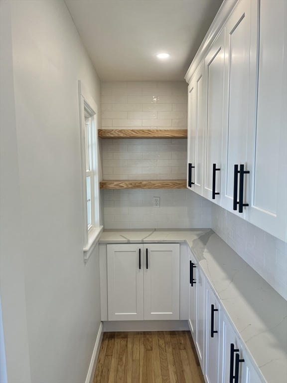 11 Park Lane Walpole, MA 02032 - Photo 9 of 27 a view of a kitchen with a sink and cabinets
