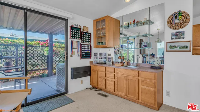 a kitchen with stainless steel appliances a sink and a large window