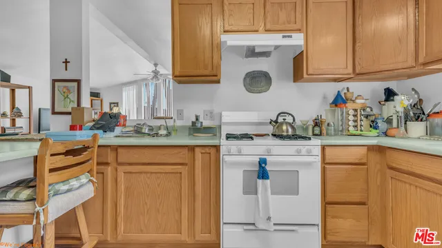 a kitchen with stainless steel appliances granite countertop a sink and cabinets