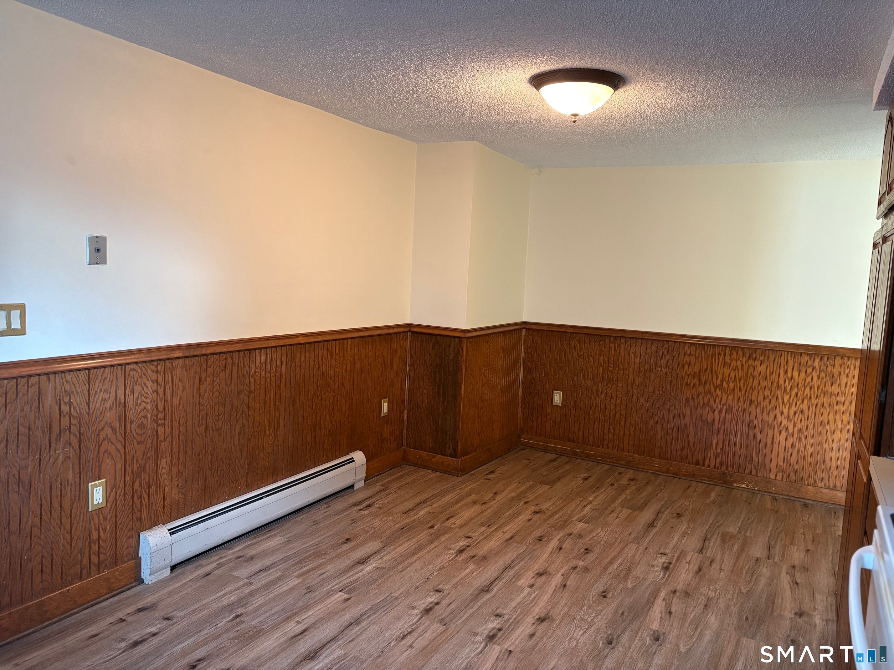 693 Broad Street Meriden, CT 06450 - Photo 5 of 19 There's a large space in the kitchen for a big kitchen table.
