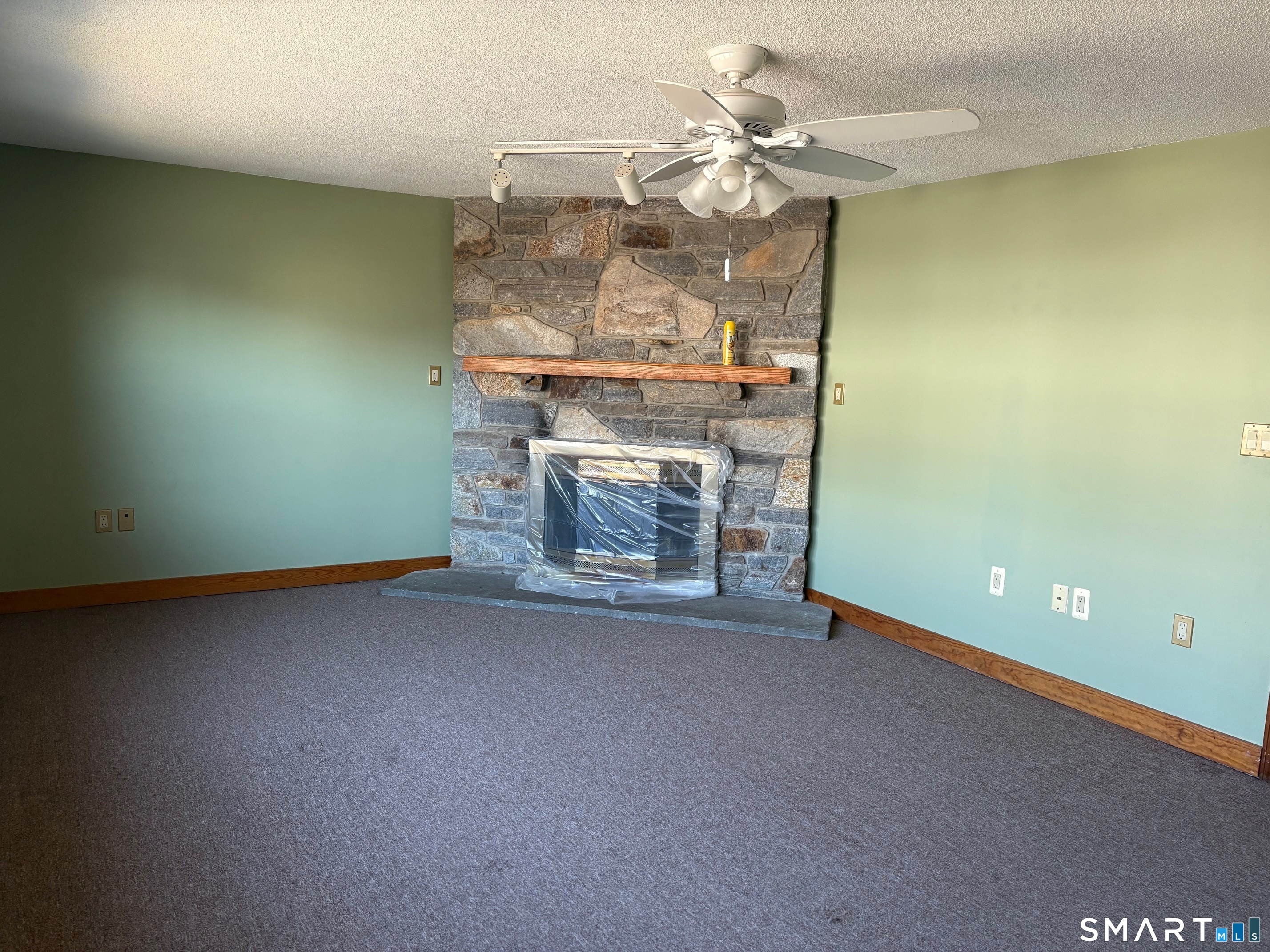 693 Broad Street Meriden, CT 06450 - Photo 6 of 19 The spacious living room is a great space for relaxing,