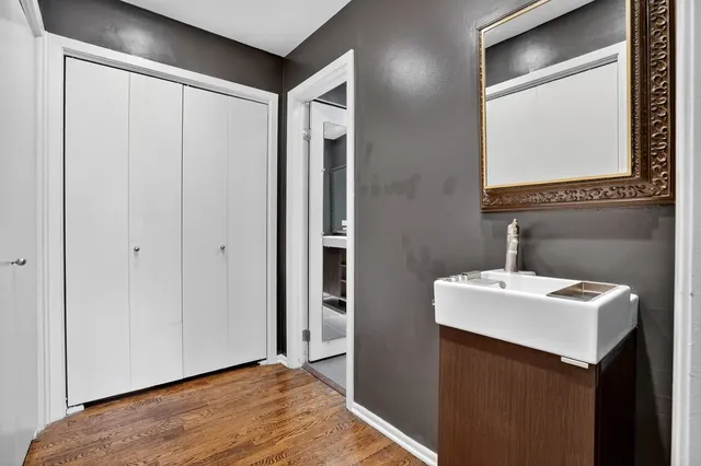 a bathroom with a sink a mirror and a toilet