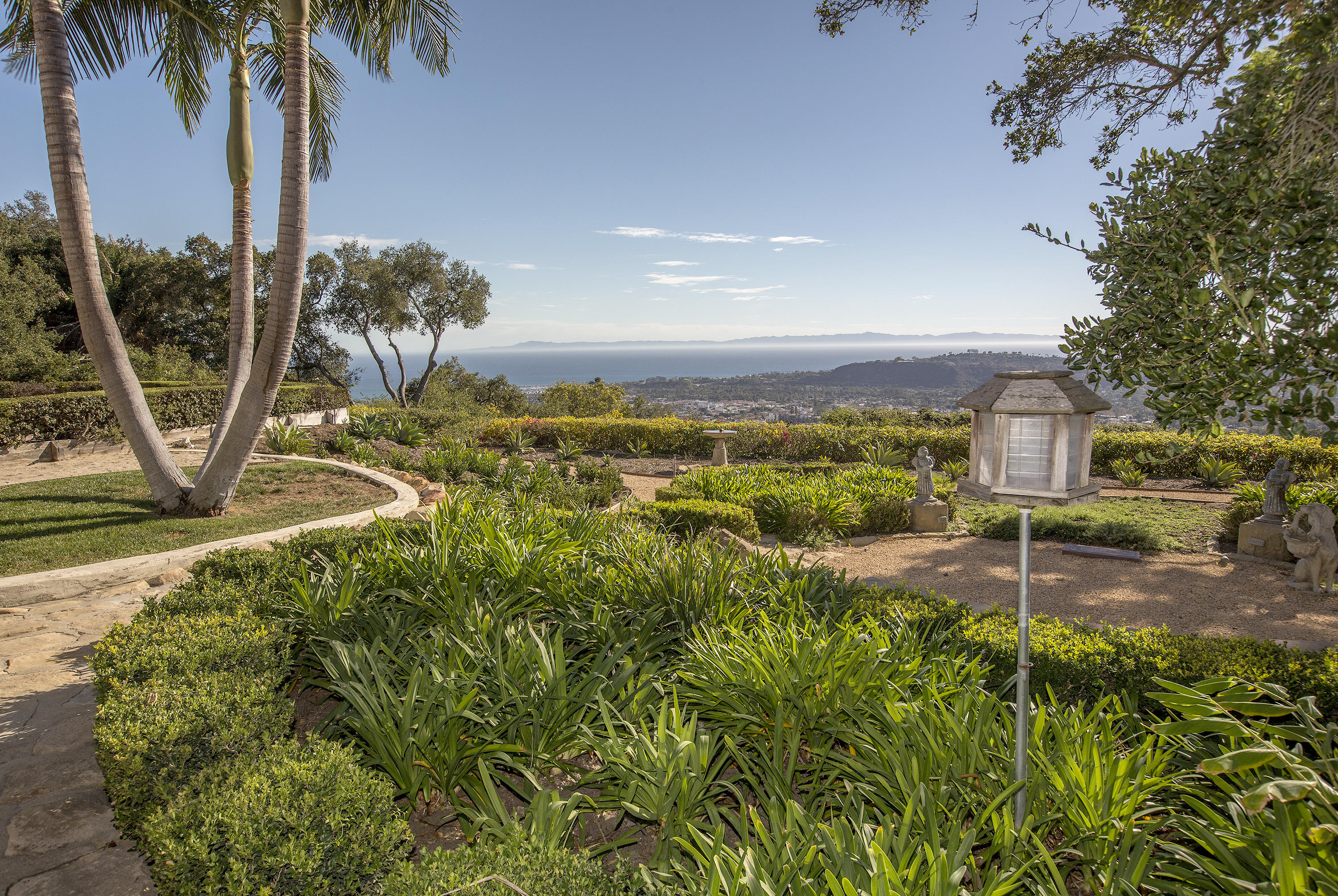 1919 Las Tunas Road Santa Barbara, CA 93103 - Photo 25 of 27 a view of a yard with a palm tree