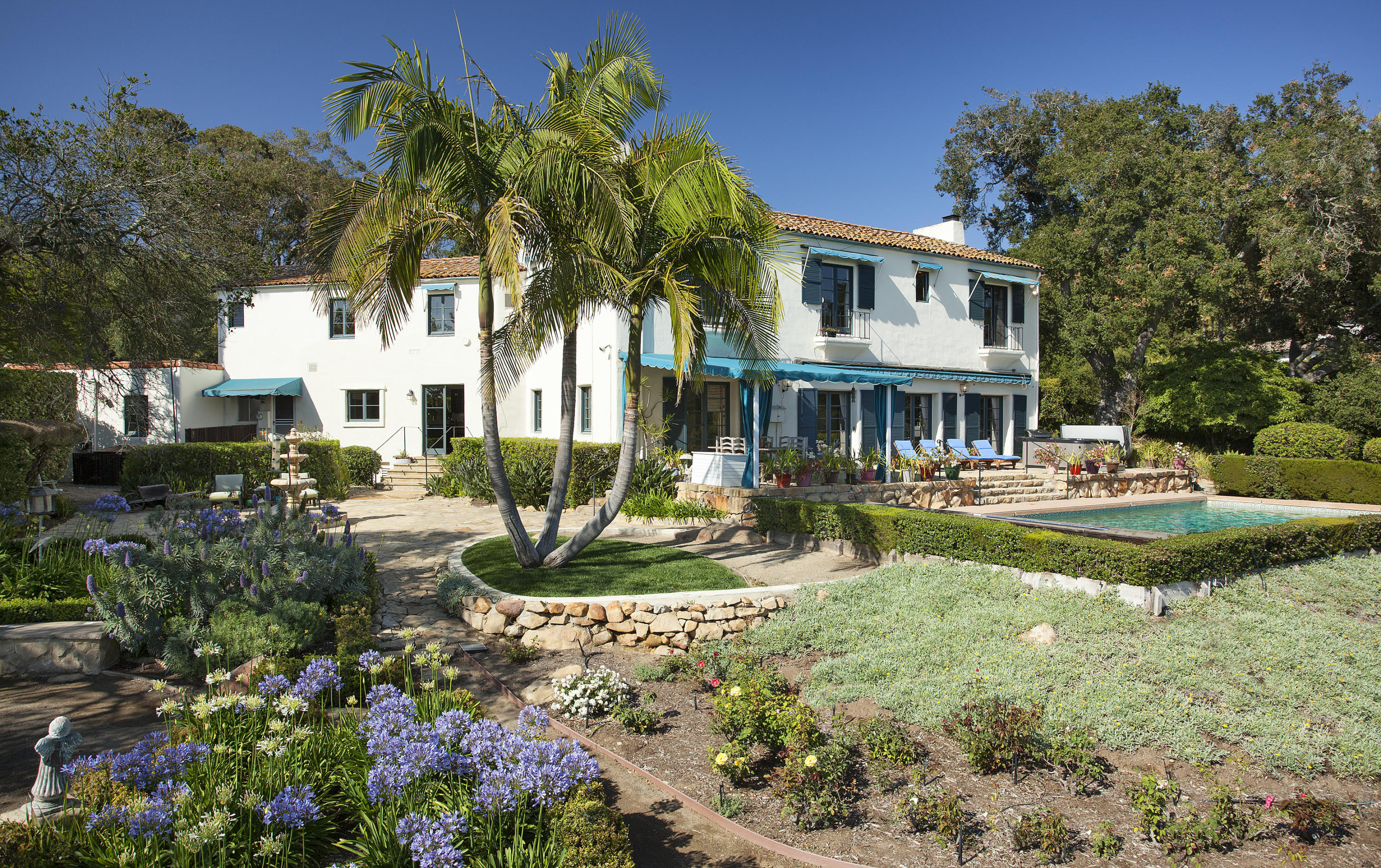 1919 Las Tunas Road Santa Barbara, CA 93103 - Photo 6 of 27 a front view of a house with garden and sitting area