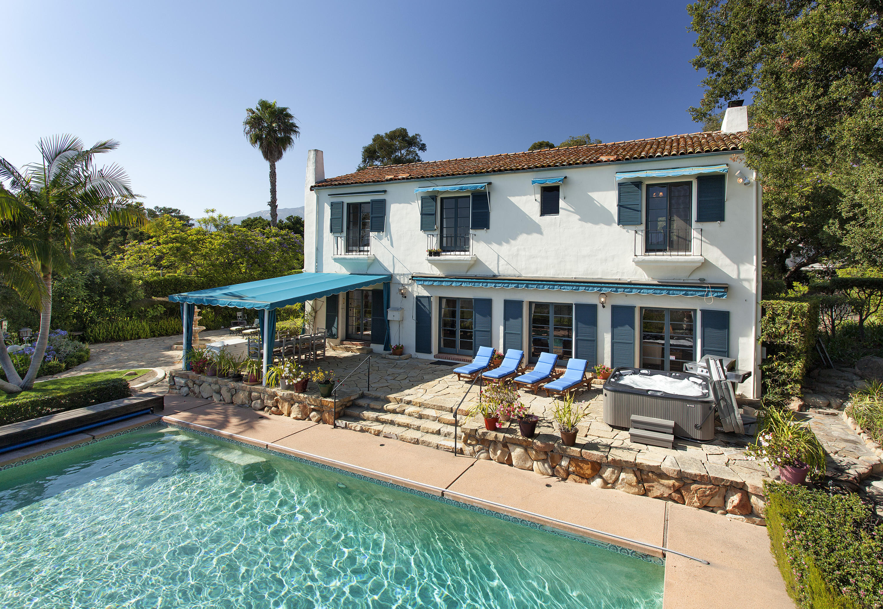 1919 Las Tunas Road Santa Barbara, CA 93103 - Photo 8 of 27 a front view of a house with garden and sitting area