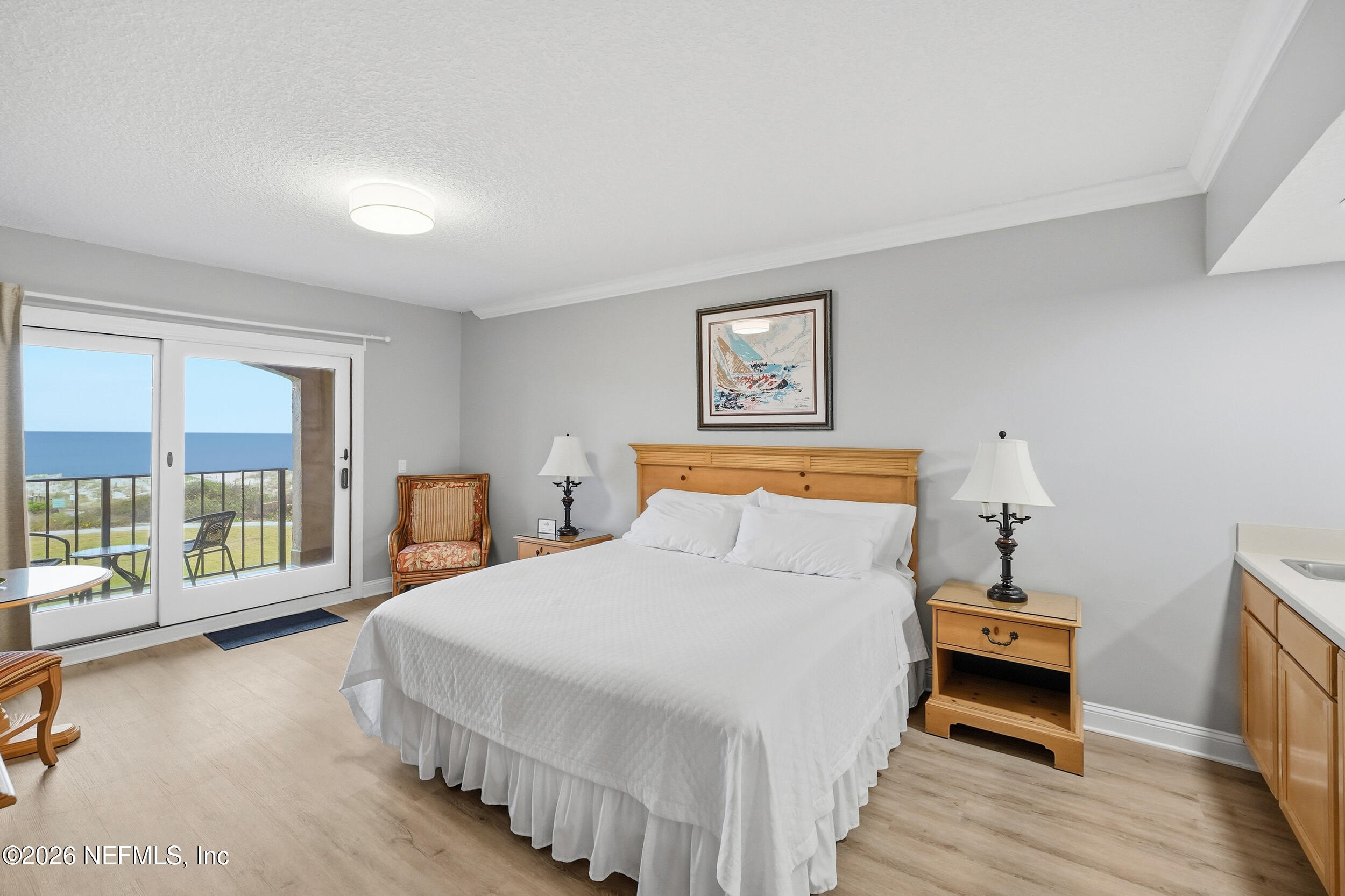 1817 Turtle Dunes Place Fernandina Beach, FL 32034 - Photo 15 of 34 a bedroom with a bed and a large window