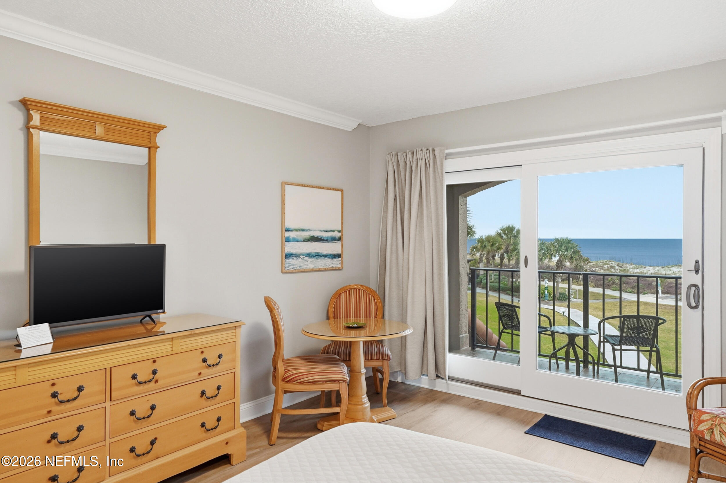 1817 Turtle Dunes Place Fernandina Beach, FL 32034 - Photo 16 of 34 a room with furniture and a flat screen tv