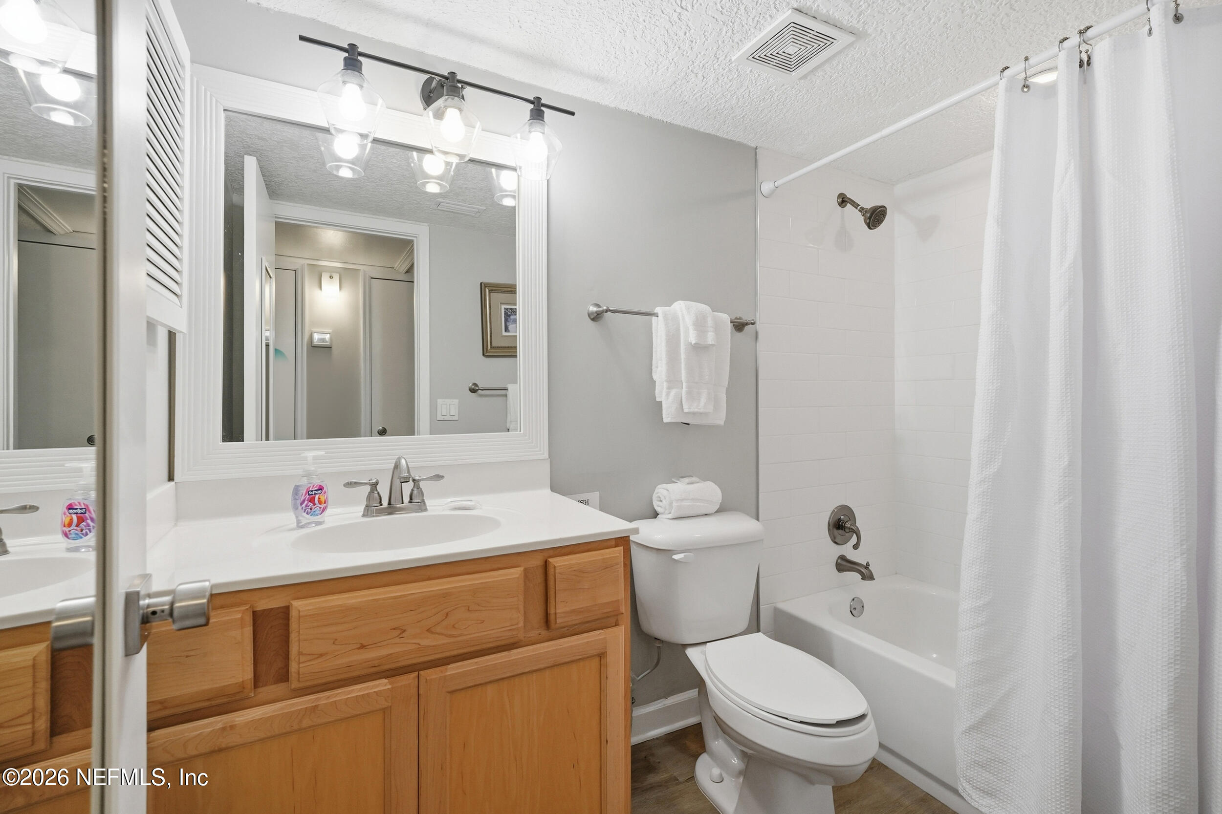 1817 Turtle Dunes Place Fernandina Beach, FL 32034 - Photo 20 of 34 a bathroom with a sink toilet vanity and shower