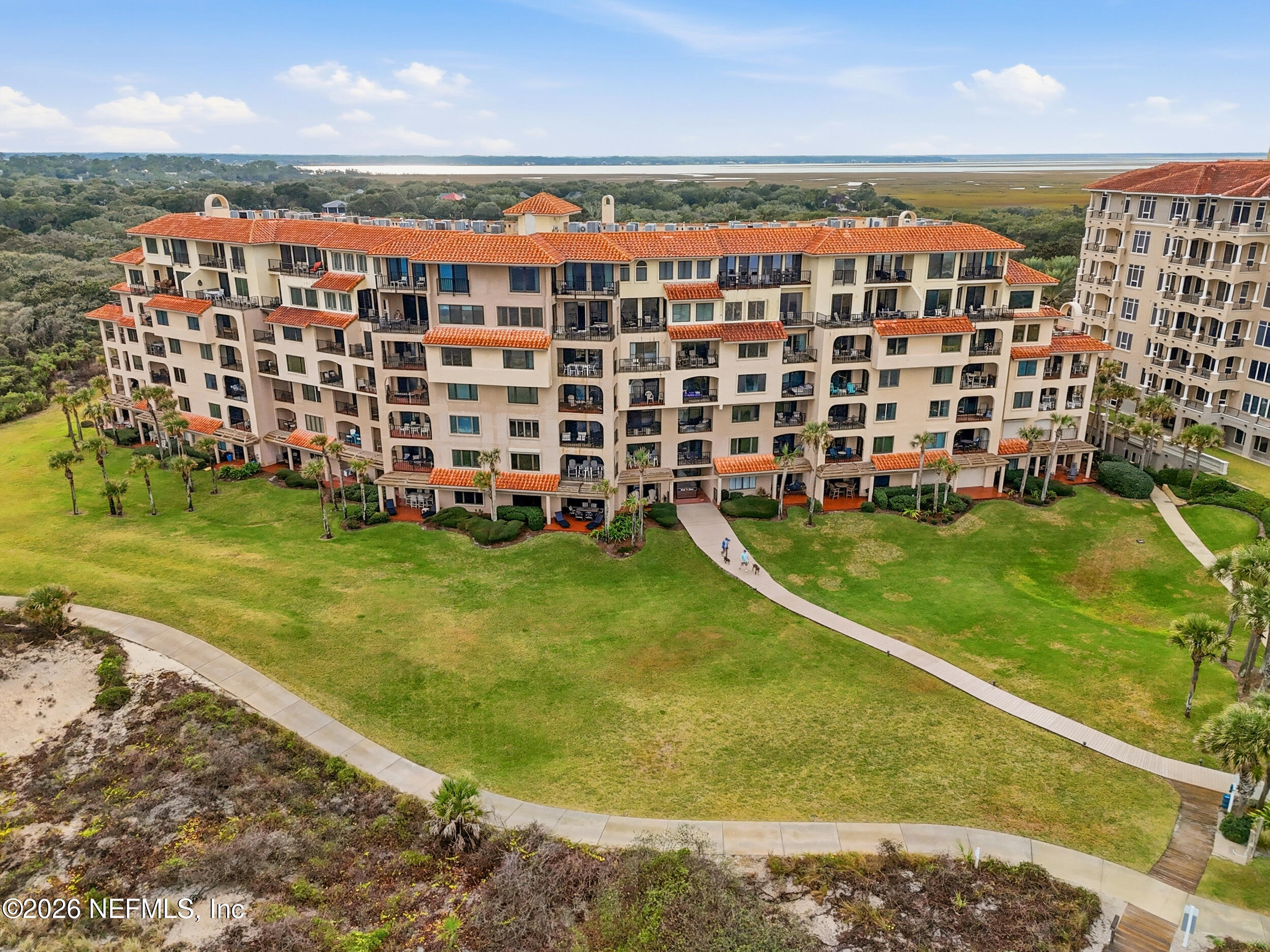 1817 Turtle Dunes Place Fernandina Beach, FL 32034 - Photo 31 of 34 a view of a large building with a big yard