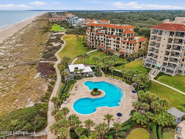 a view of swimming pool with a balcony