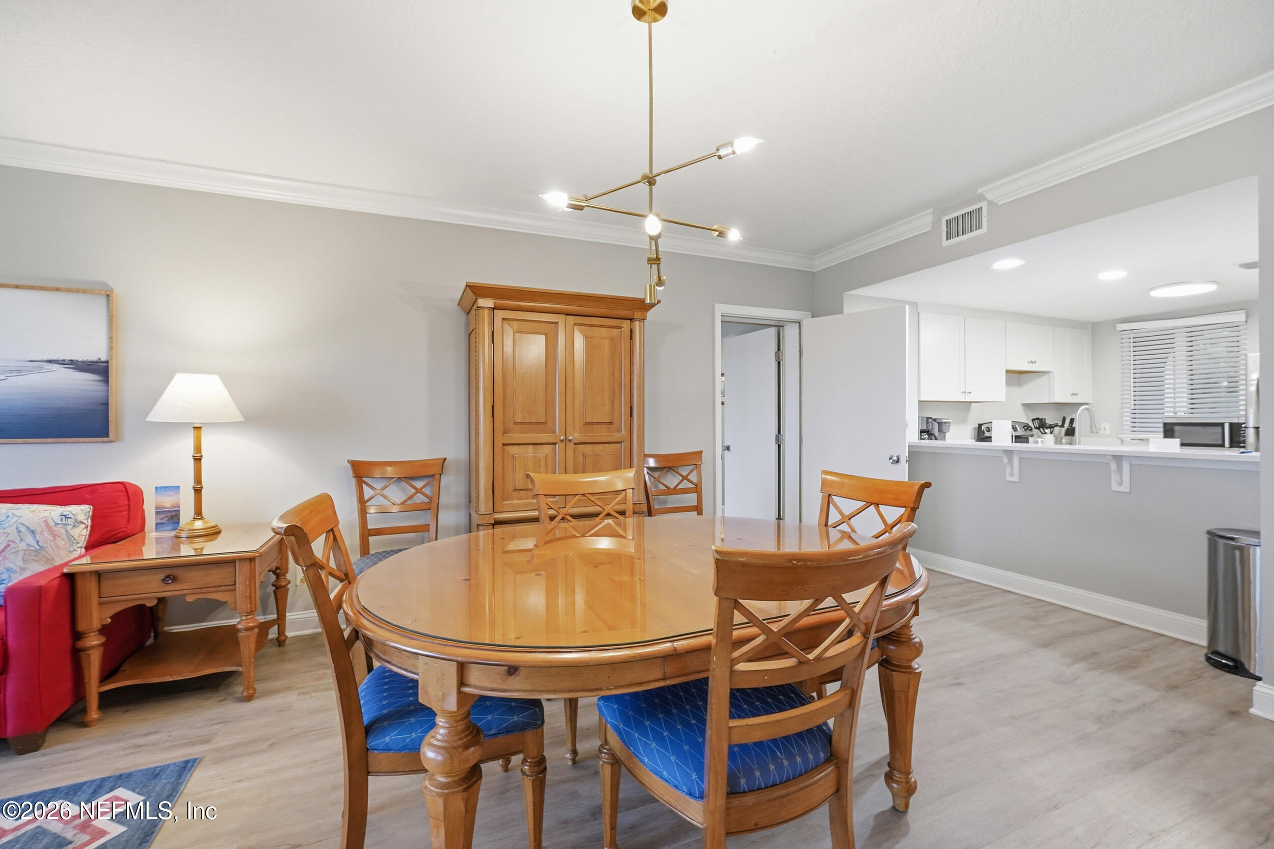 1817 Turtle Dunes Place Fernandina Beach, FL 32034 - Photo 4 of 34 a dining room with furniture and window