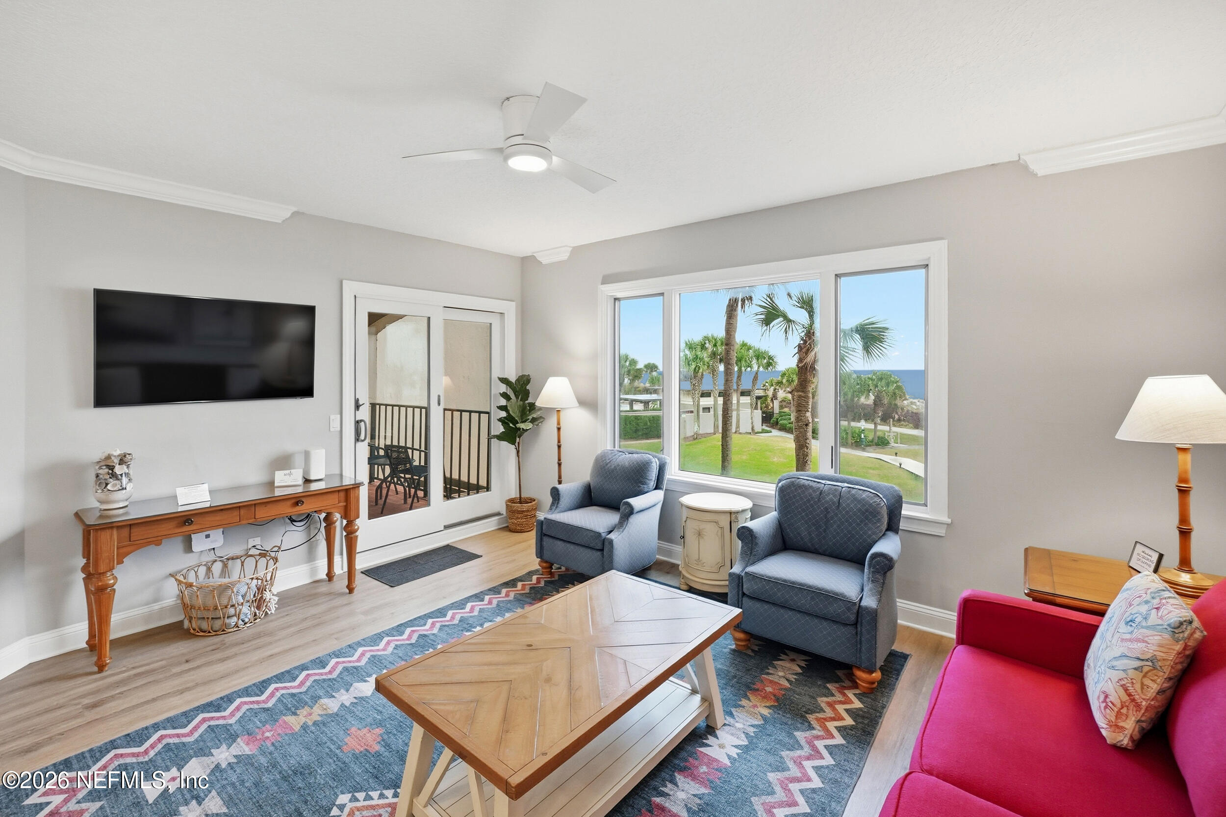 1817 Turtle Dunes Place Fernandina Beach, FL 32034 - Photo 6 of 34 a living room with furniture and a flat screen tv