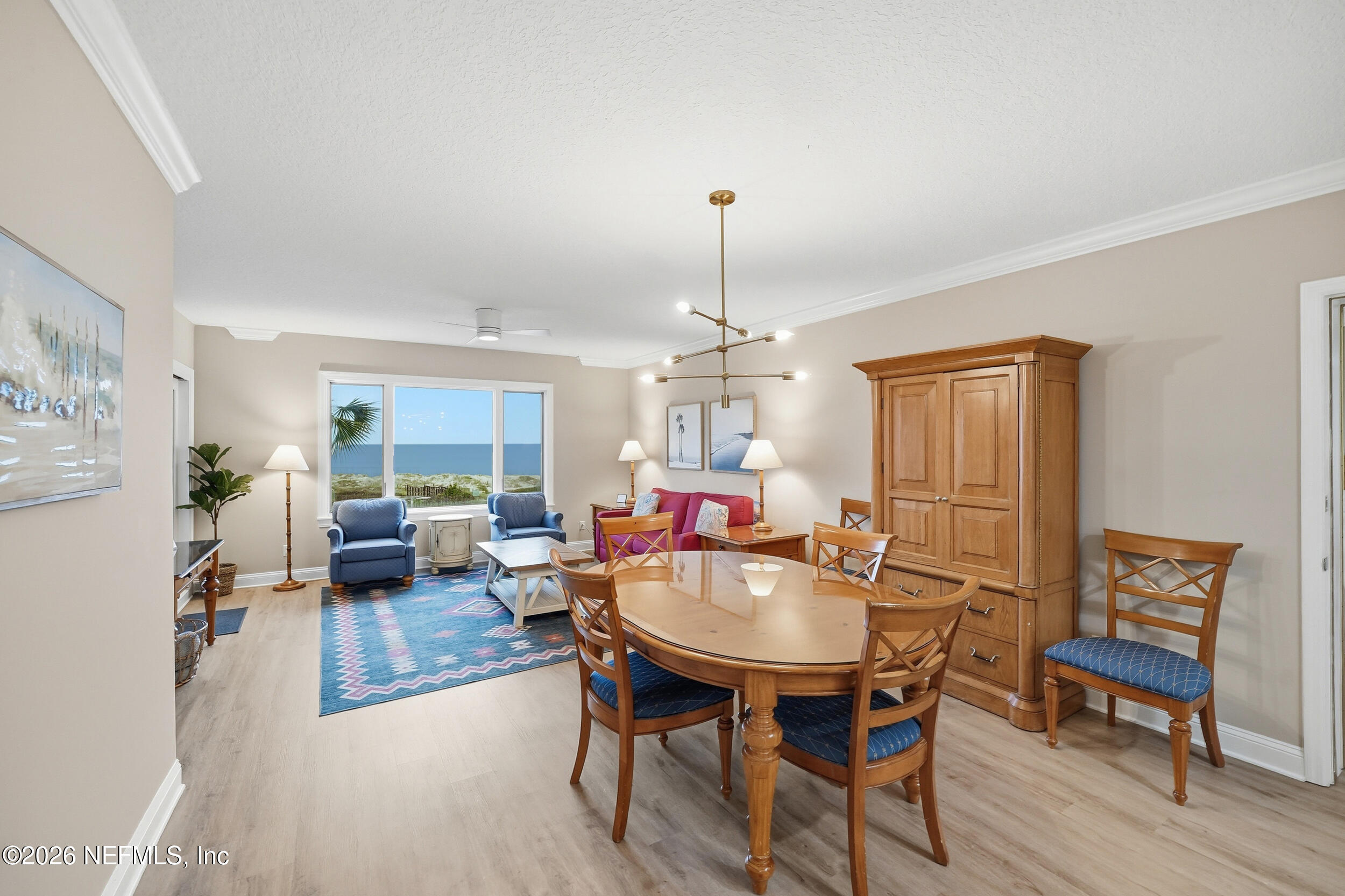 1817 Turtle Dunes Place Fernandina Beach, FL 32034 - Photo 8 of 34 a open dining room with furniture window and wooden floor
