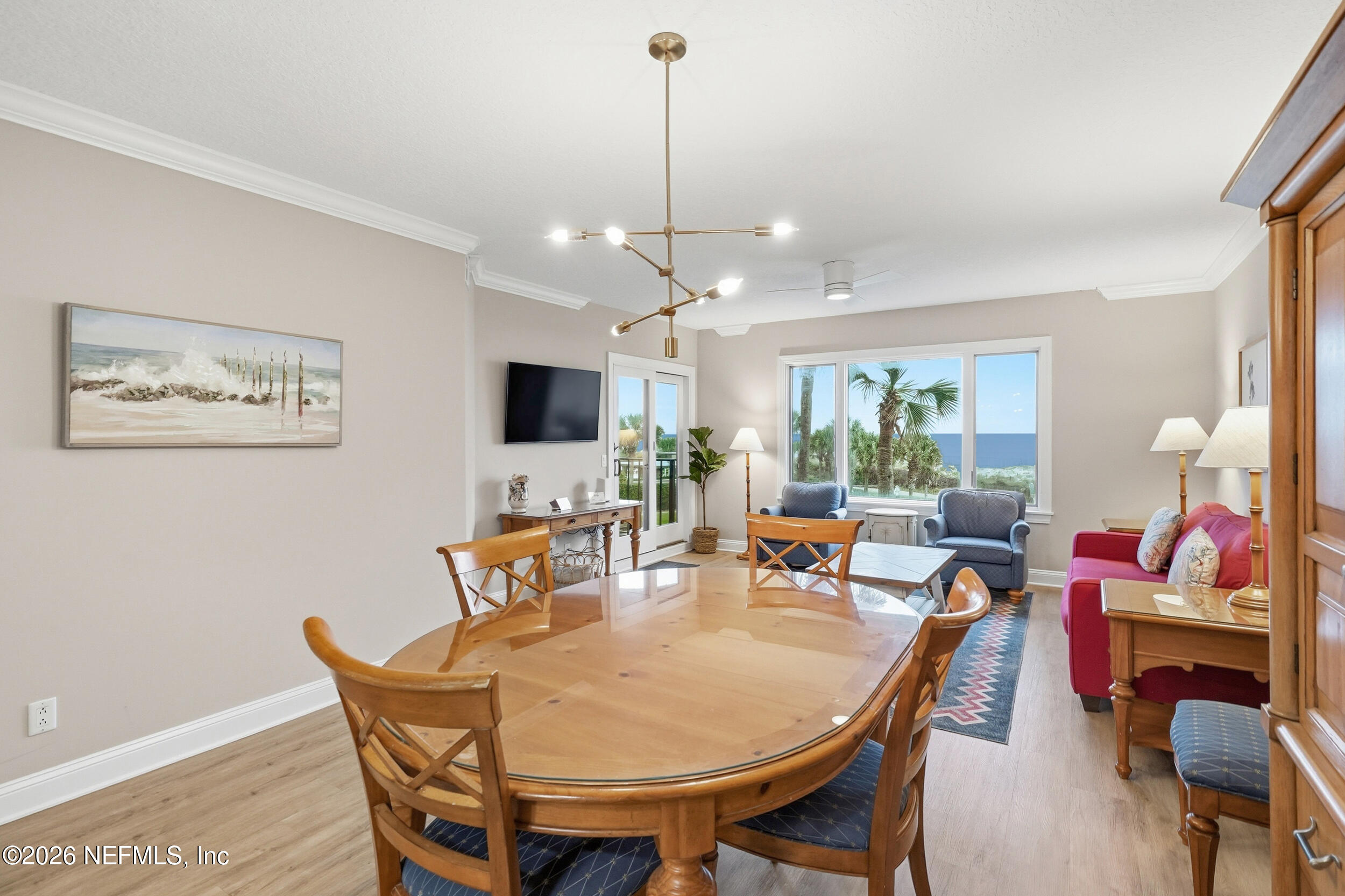1817 Turtle Dunes Place Fernandina Beach, FL 32034 - Photo 9 of 34 a view of a dining room with furniture window and wooden floor