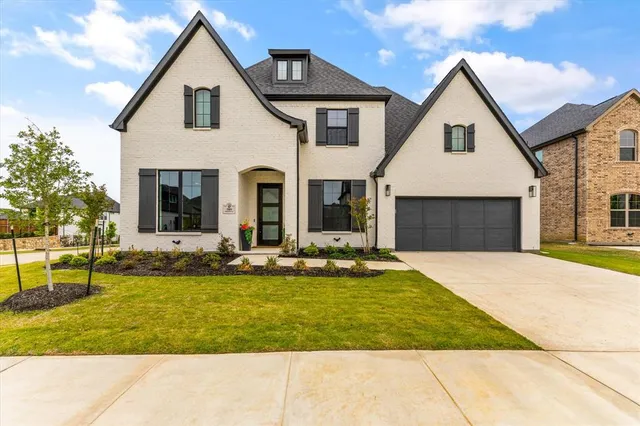 a view of house with yard outdoor seating and entertaining space