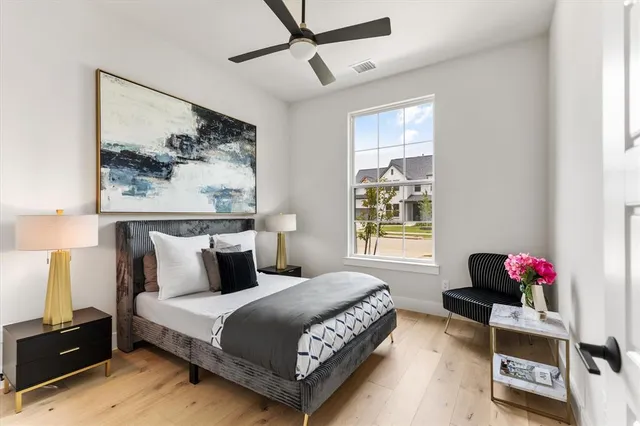 a bedroom with bed and a window