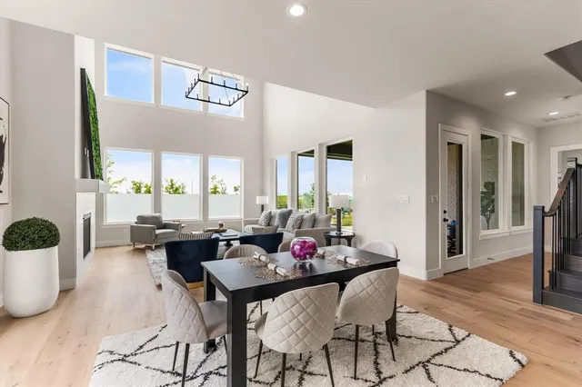 a view of a dining room with furniture and a potted plant