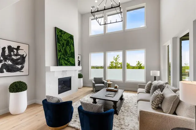 a living room with furniture a window and a fireplace