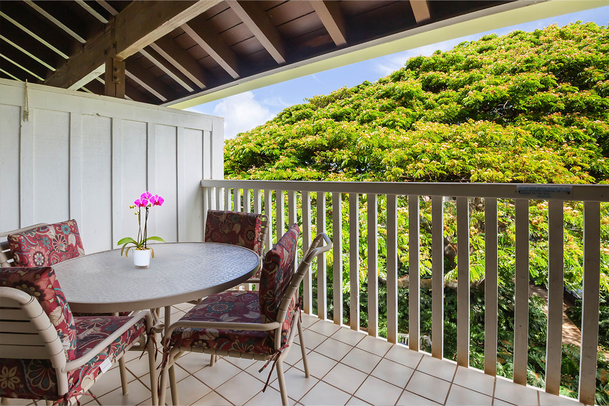 2253 Poipu Road, Unit 230 Koloa, HI 96756 - Photo 11 of 27 a view of balcony with a dining table and chairs