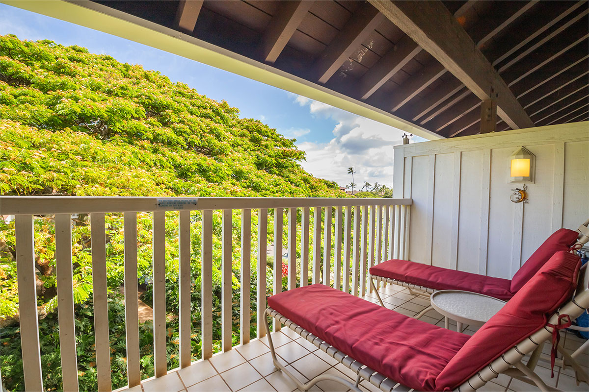 2253 Poipu Road, Unit 230 Koloa, HI 96756 - Photo 12 of 27 a view of a chair in wooden deck