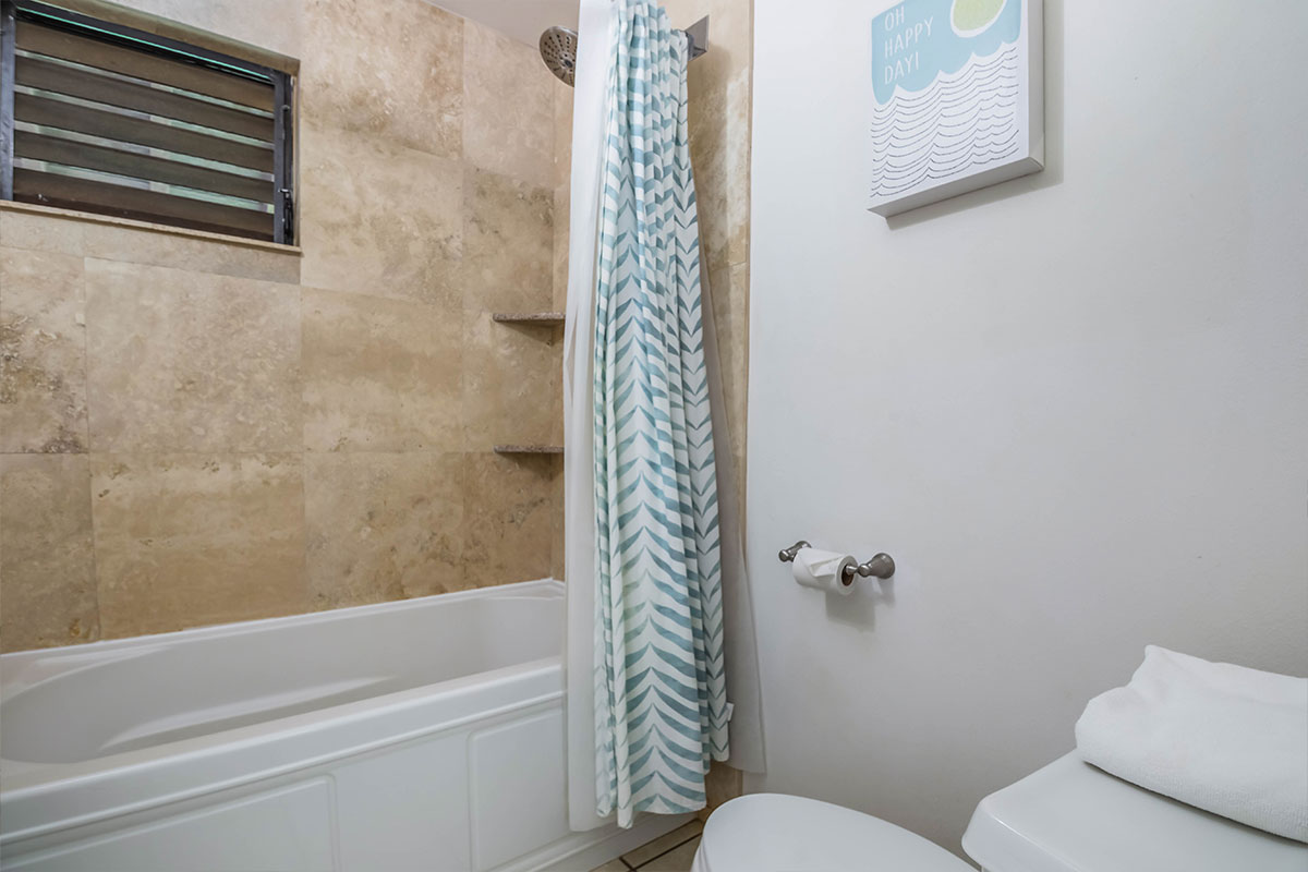 2253 Poipu Road, Unit 230 Koloa, HI 96756 - Photo 15 of 27 a bathroom with a toilet and a bathtub